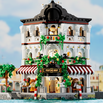 Front view of IAMBRICK Riverside Perfume Shop with striped awnings, flowers and balconies